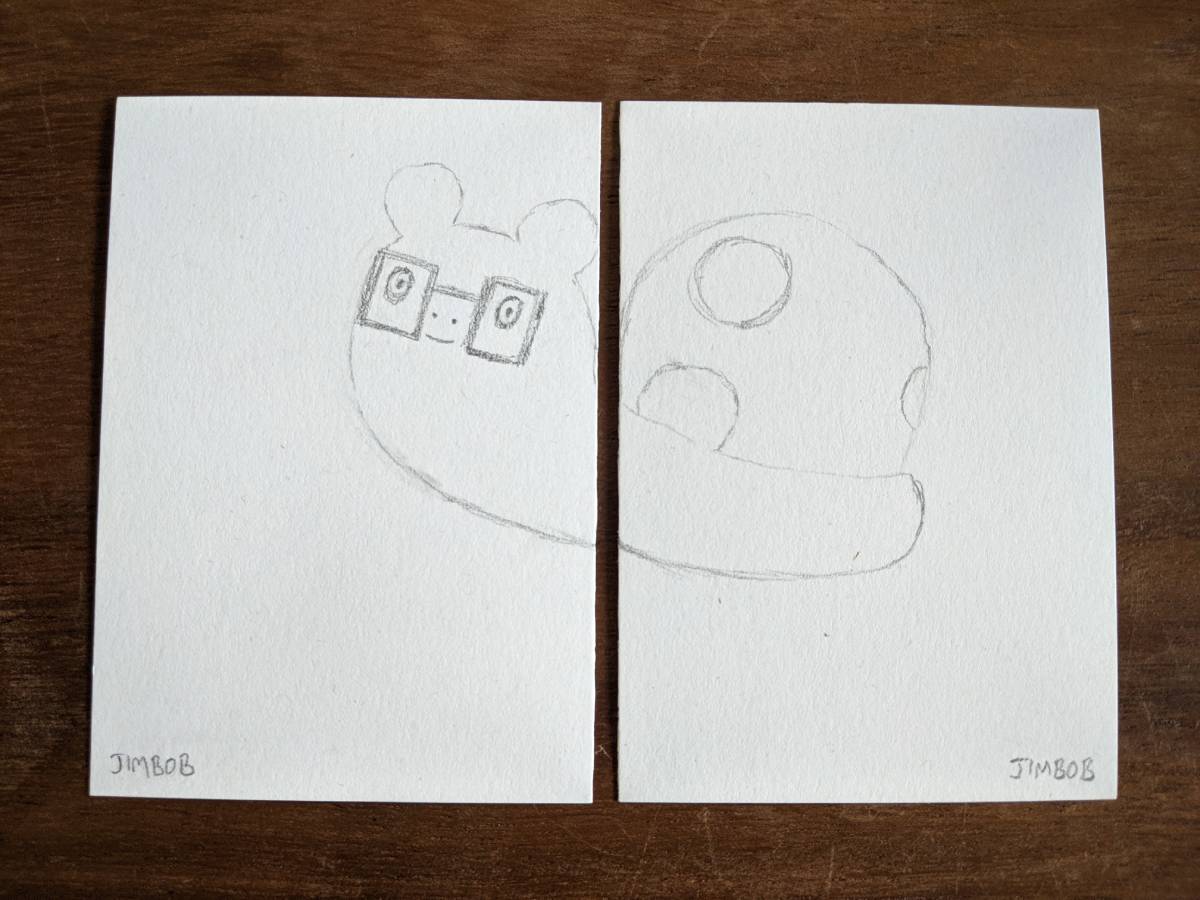 a sketch of JimBob the snail over 2 pieces of paper so that the body is split in half where the 2 marks line up