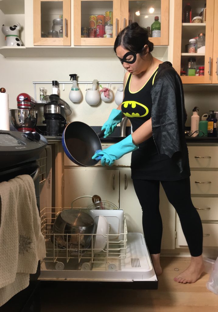 Superhero doing dishes
