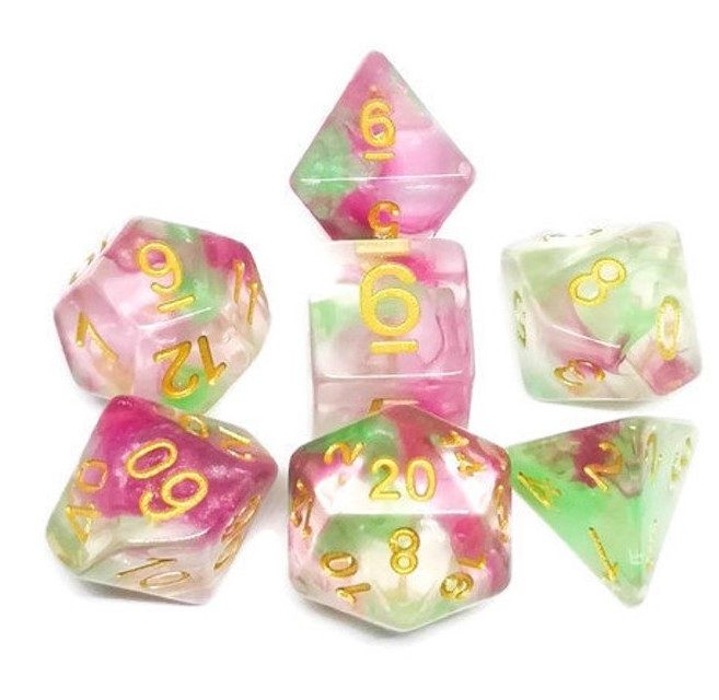 Clear dice with swirls of pink and bright spring green.