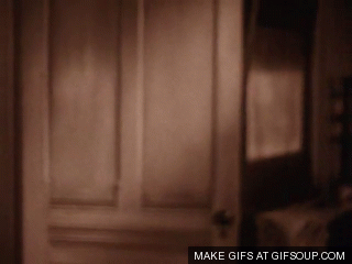 An animated GIF from the film The Wizard of Oz showing a black and white Dorothy Gale (played by Judy Garland) opening a door tothe Technicolor world of Oz.