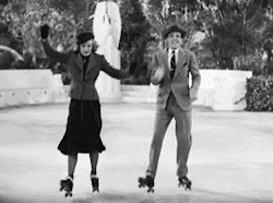 A moving GIF from the film Shall We Dance, showing Fred Astaire and Ginger Rogers performing a tap-dance routine wearing roller skates.