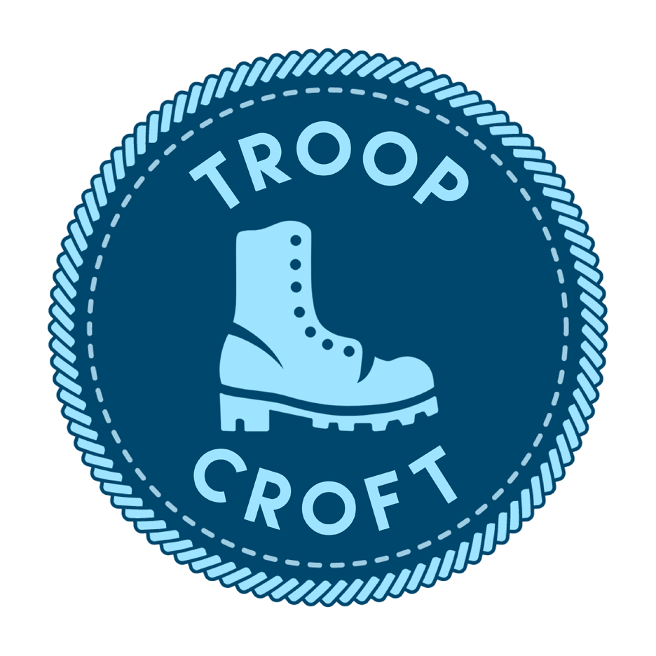 A blue merit badge that reads "Troop Croft" and has a picture of a boot.