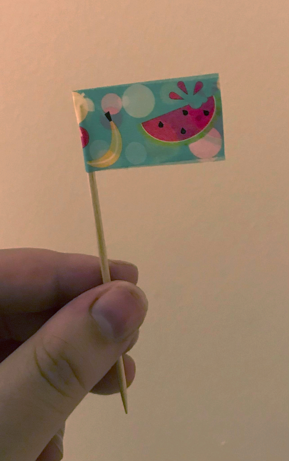 A cute little flag on a toothpick! It's got fruit on it!