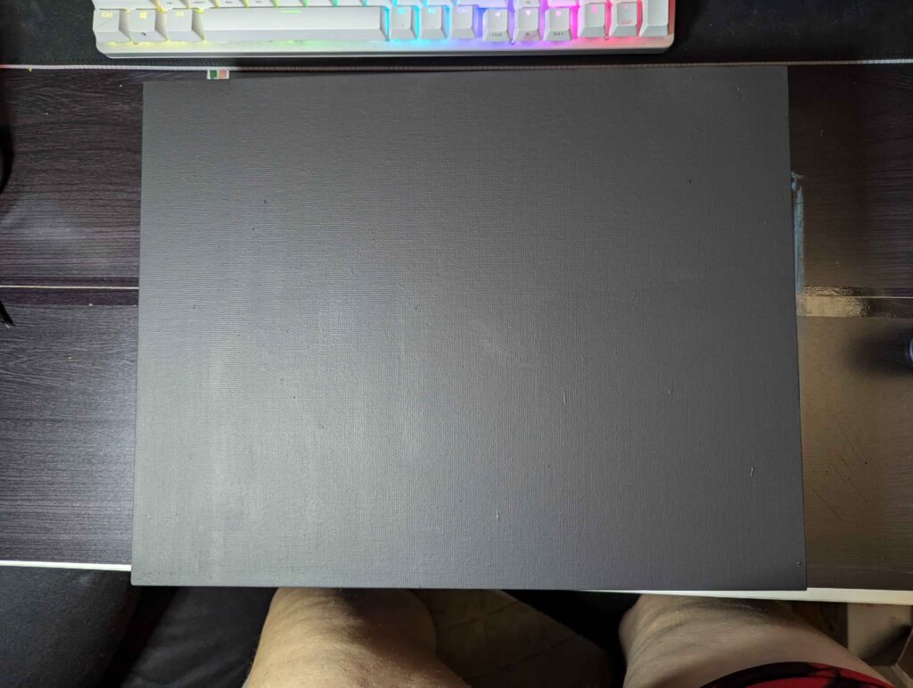 a rectangular canvas painted with an even layer of blank paint