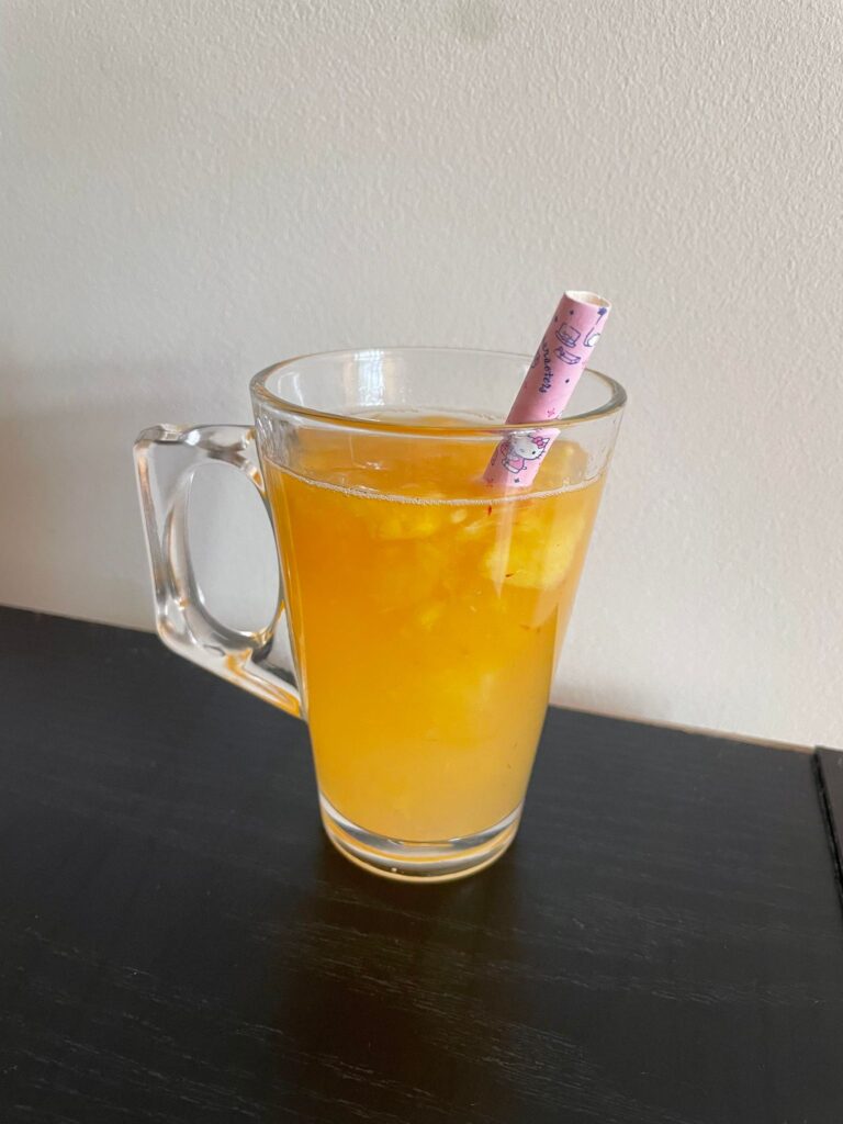 A finished lemonade treat with a pink straw