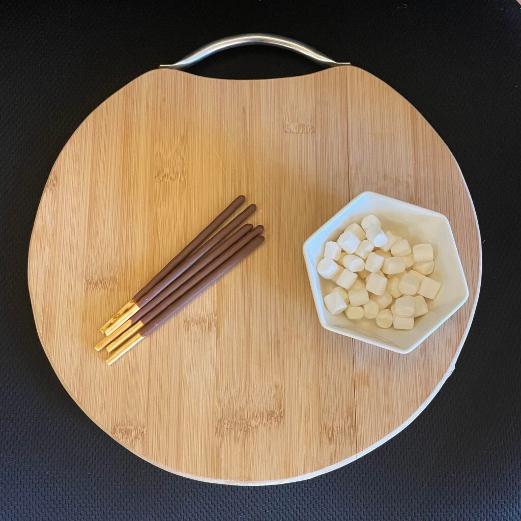 supplies for this project assembled on a round wooden cutting board