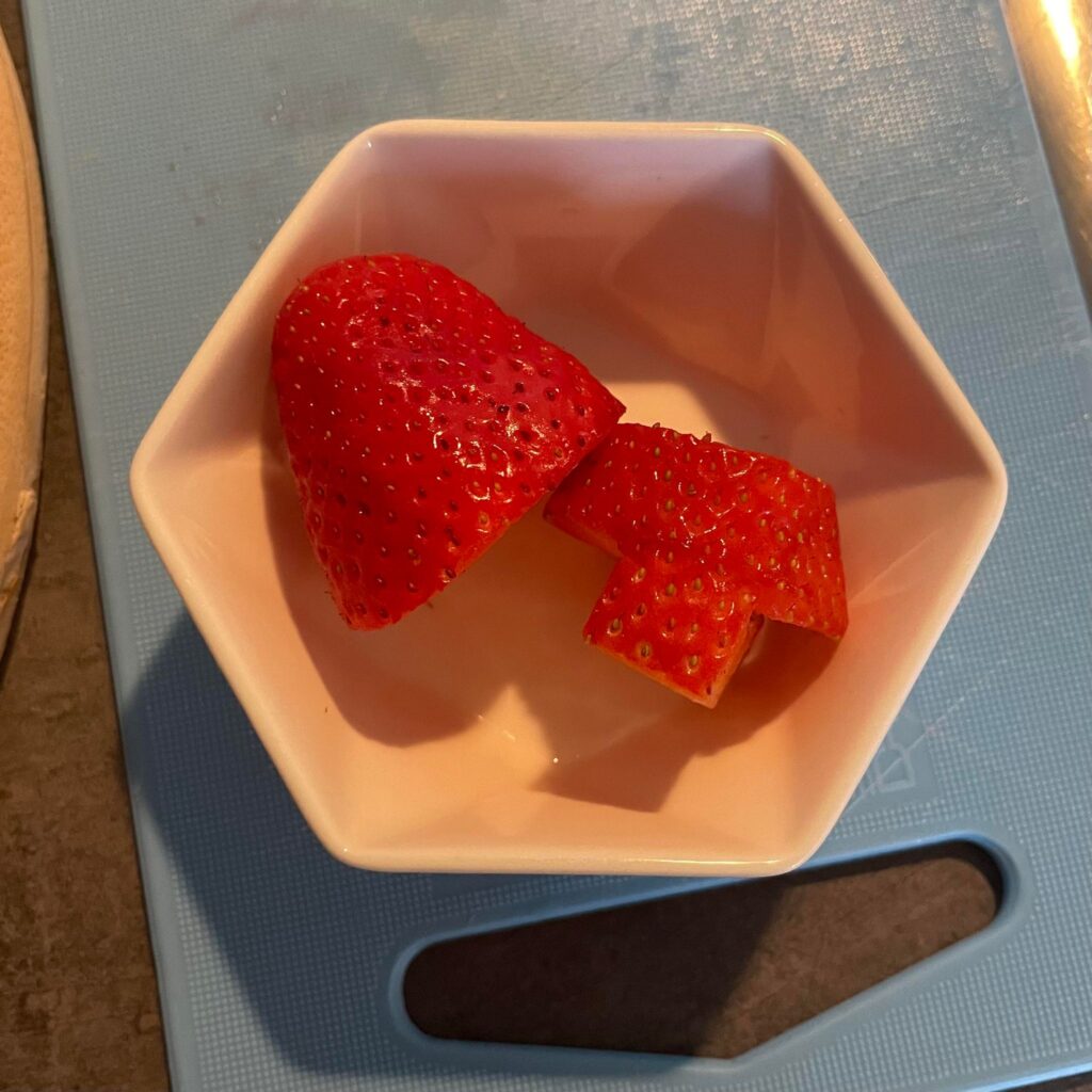 strawberries cut into rocket ship shapes