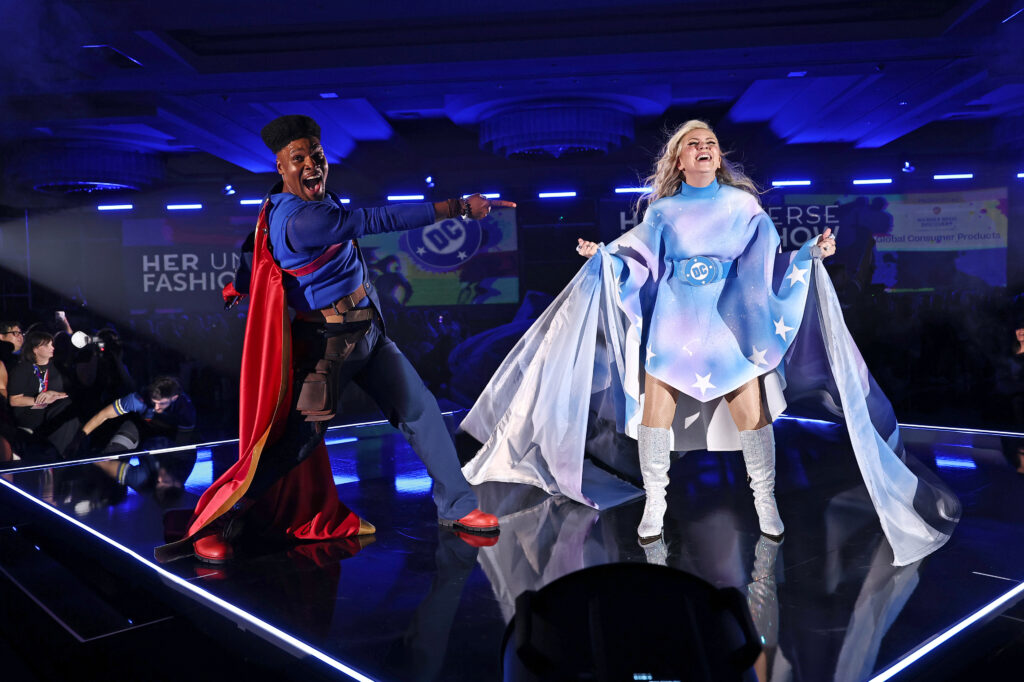 Michael James Scott in a Superman-inspired suit and Ashley Eckstein in a cloud-inspired air brushed dress take the stage