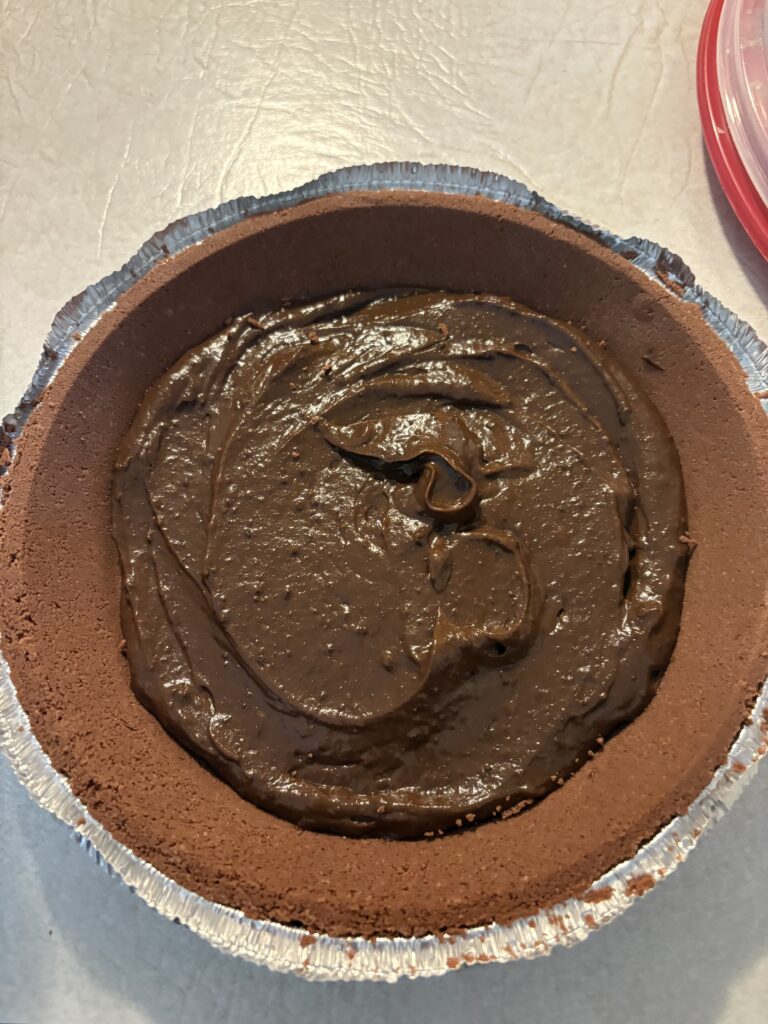 mixed pudding placed into the center of a pie shell