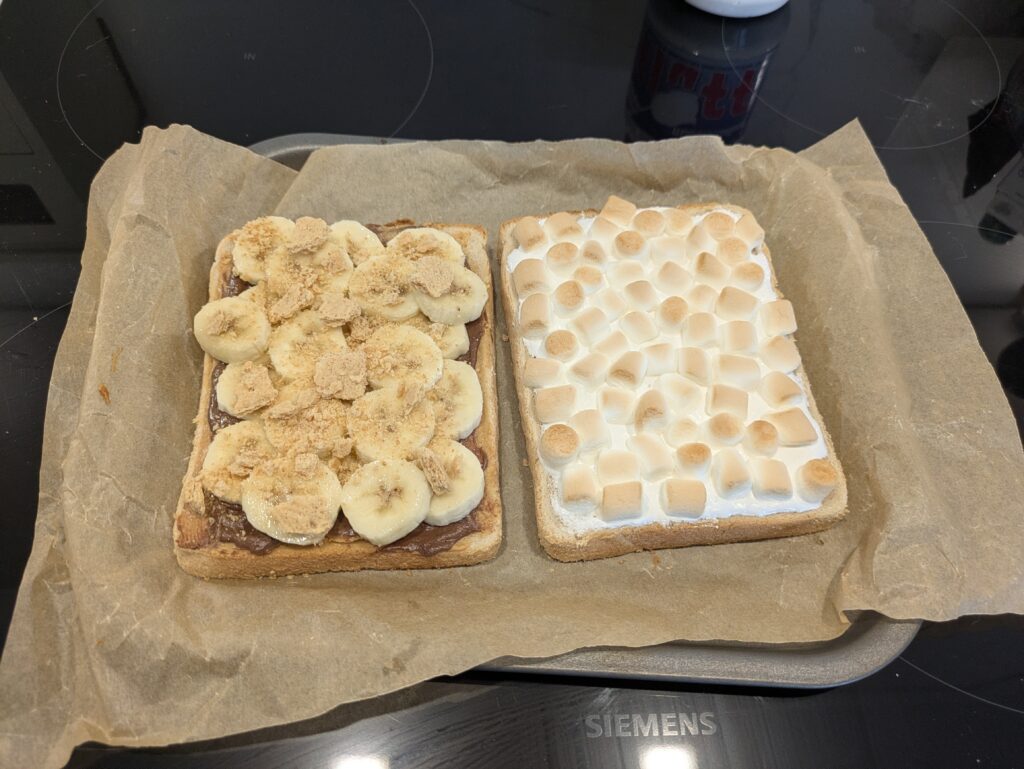 the two slices of bread now with marshmallows and bananas